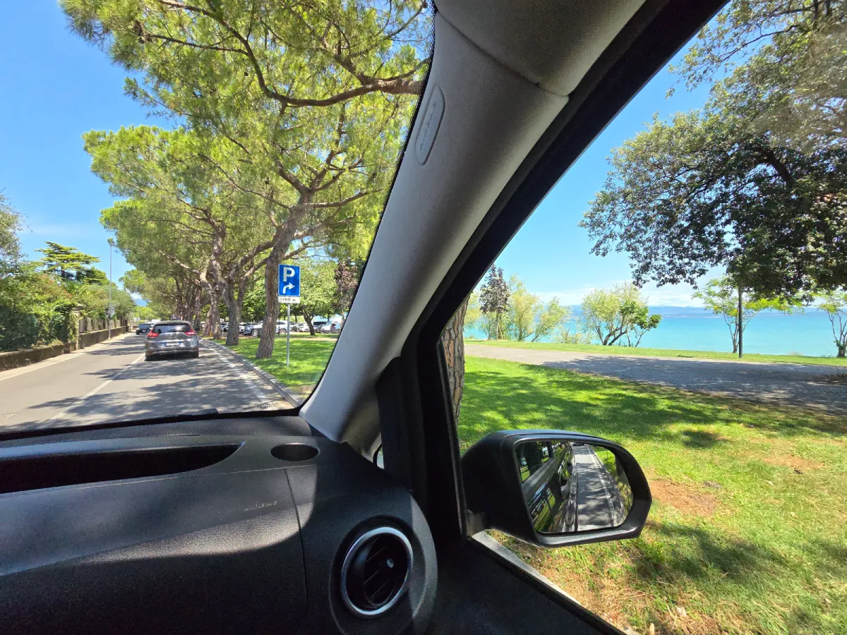 Premium car driving along the road in Sirmione, Lake Garda, Italy